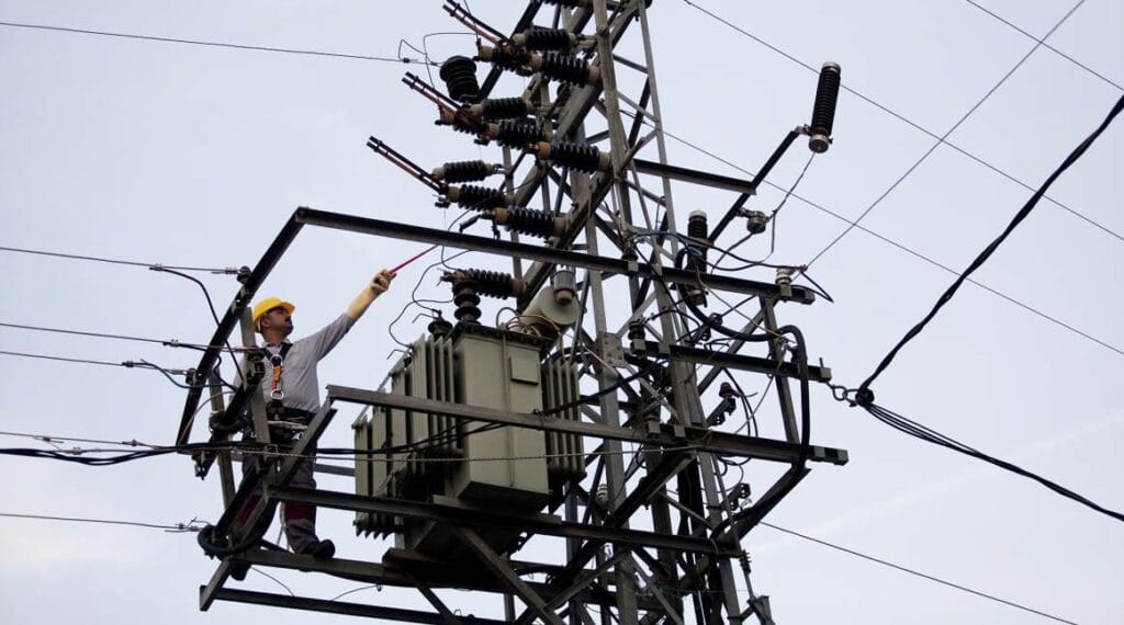 Technician inspecting a distribution transformer during Ethiopia grid upgrade